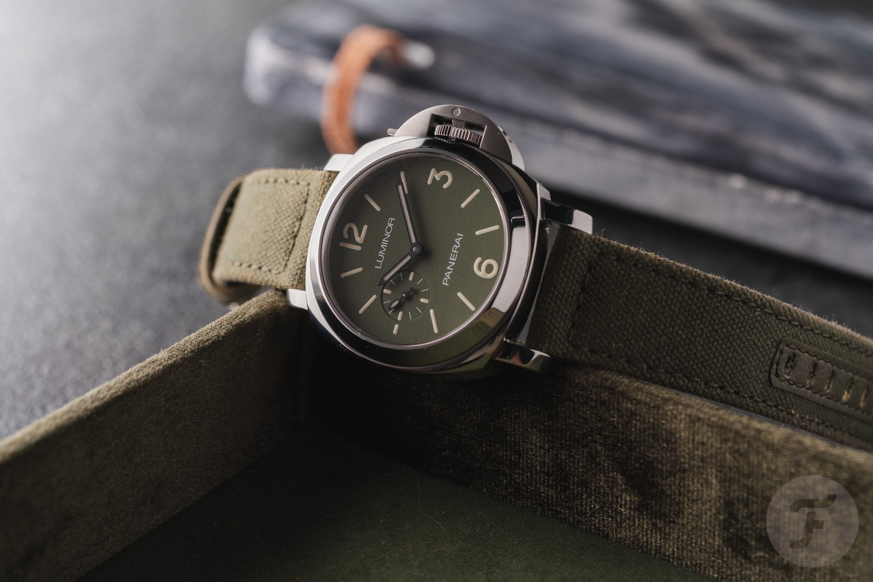 Panerai Luminor PAM01711 on edge of tray, crown up