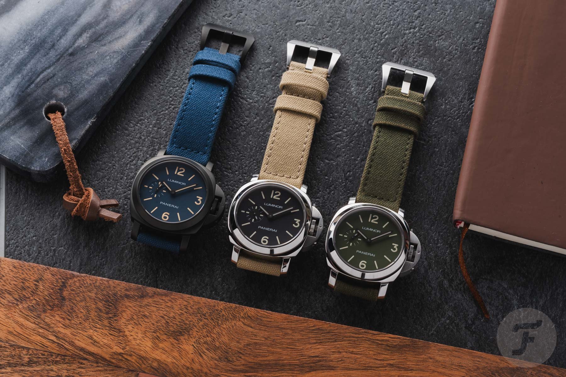 Panerai Luminor PAM01710, PAM01711, and PAM01714 lined up, flat-lay