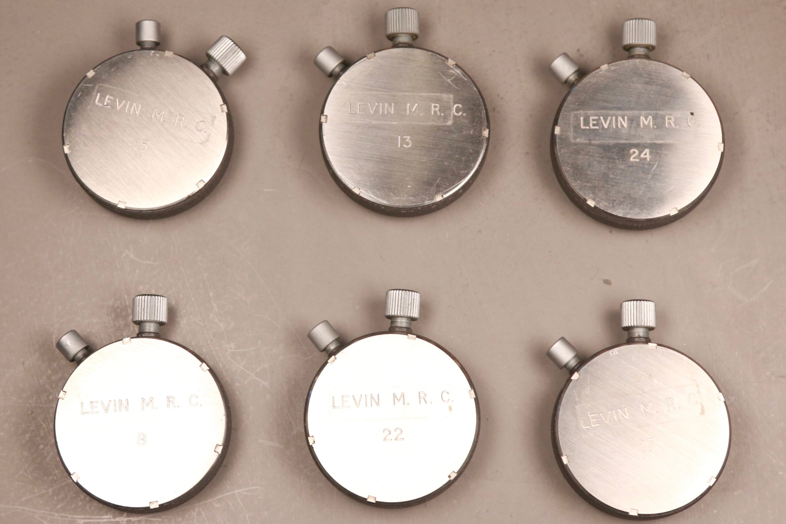 case backs of Omega stopwatches from Levin Motor Racing Circuit