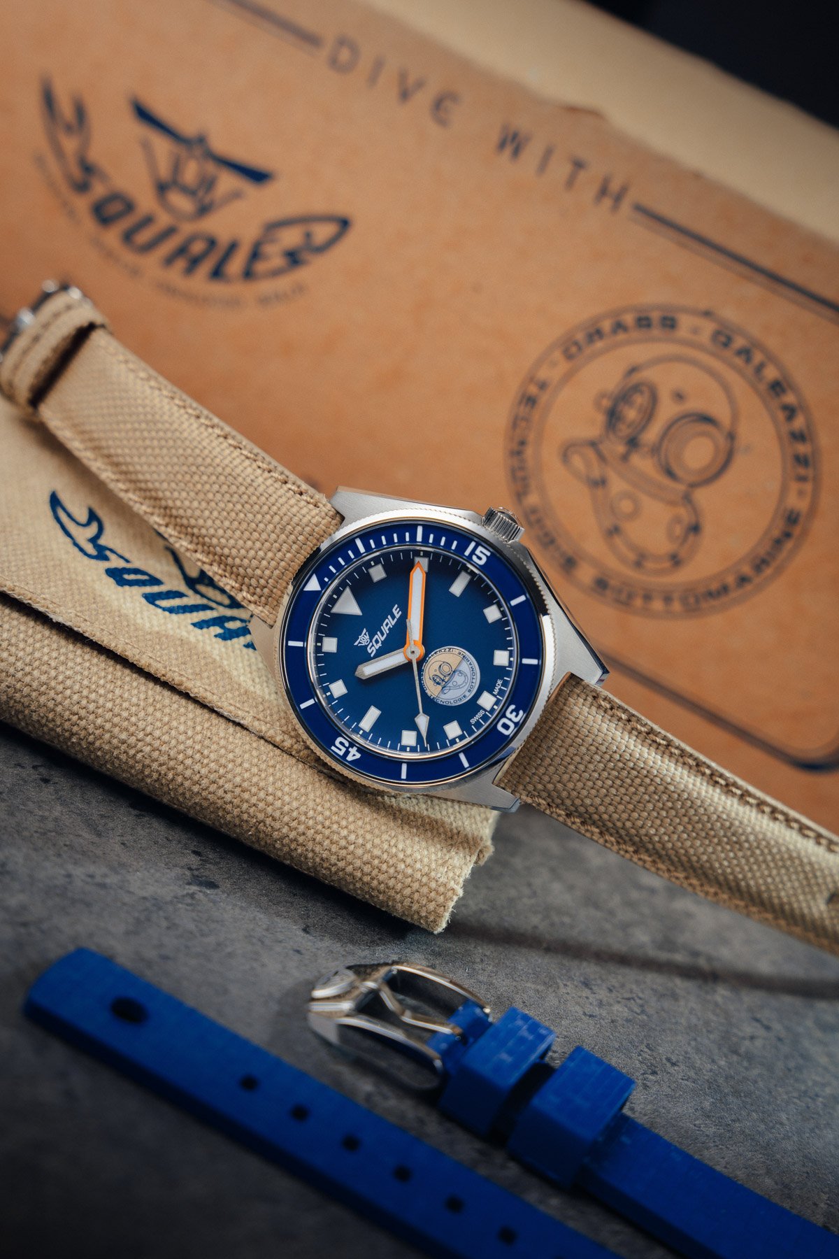 Squale Galeazzi Artiglio on its side, crown up, on top of travel pouch