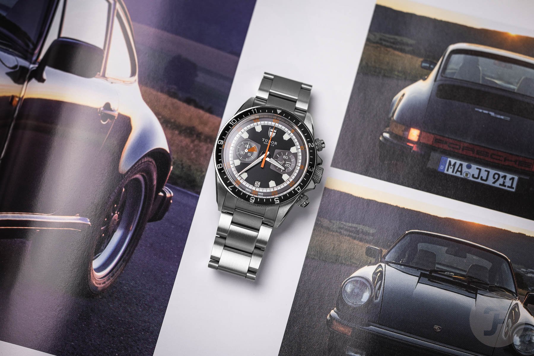 discontinued watches — Tudor Heritage Chrono flat-lay on top of Porsche magazine