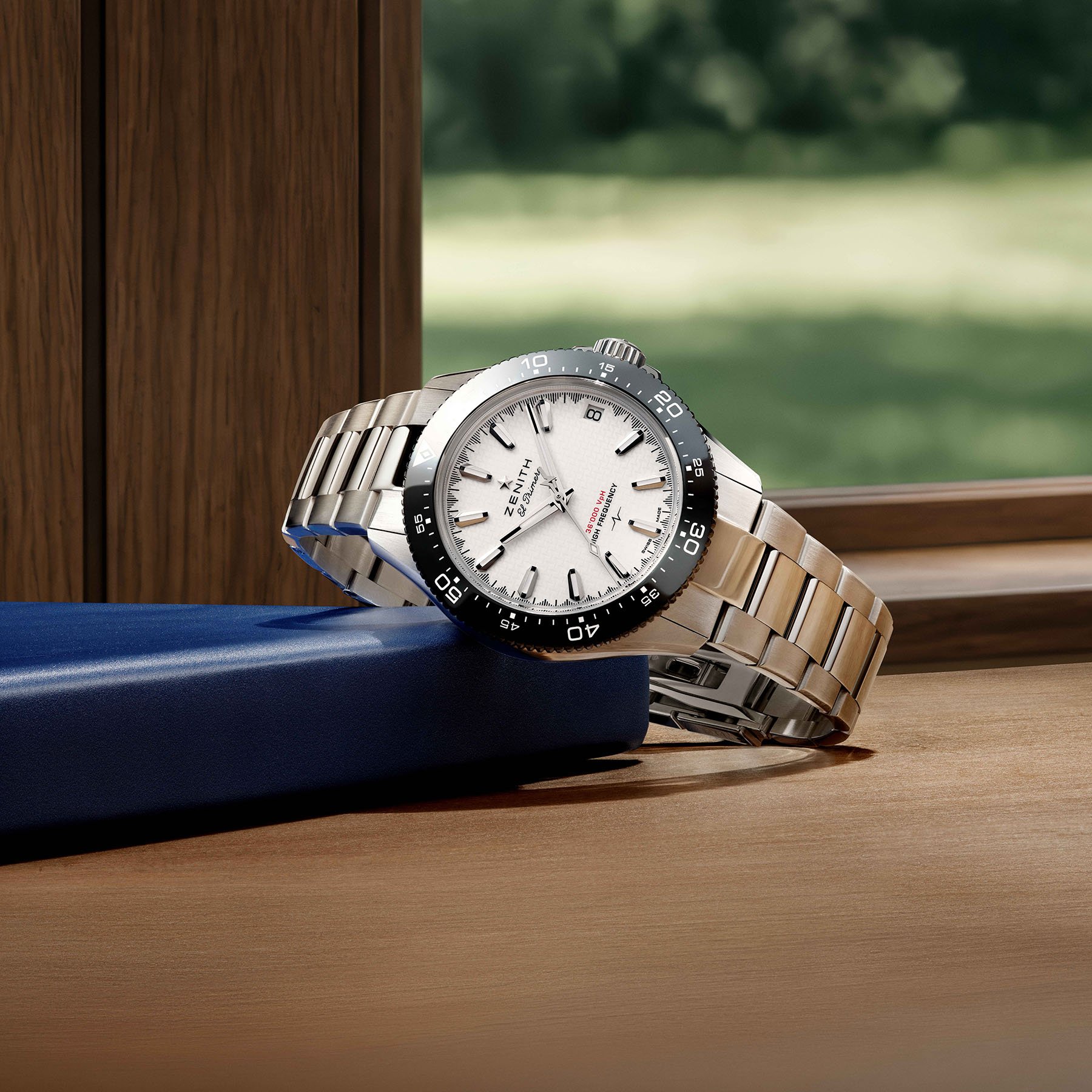 white-dial Zenith Chronomaster Solo Sport on its side, crown up