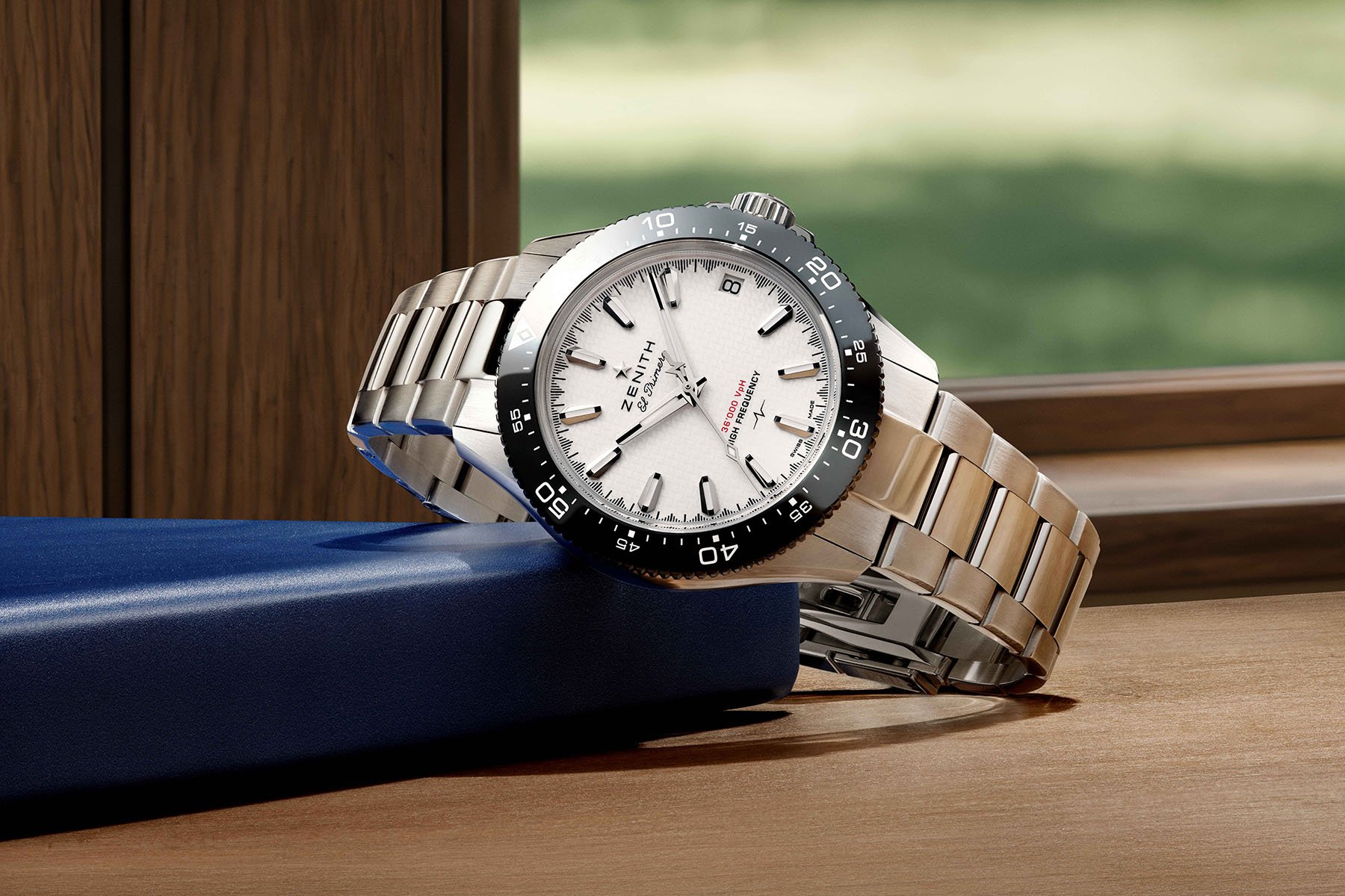white-dial Zenith Chronomaster Solo Sport on its side, crown up