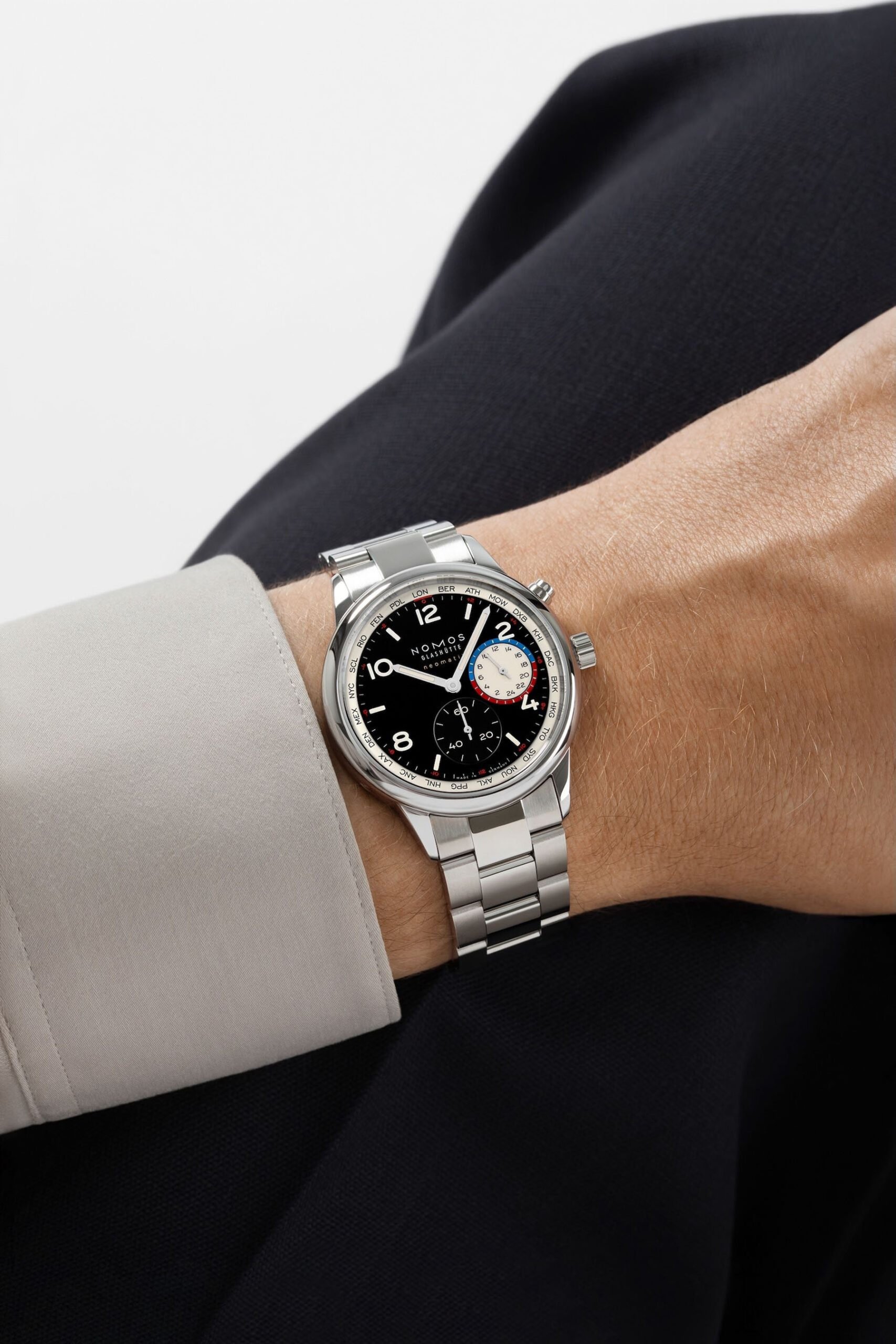 September 2026 releases — Nomos Club Sport Neomatik Worldtimer Dark wrist shot