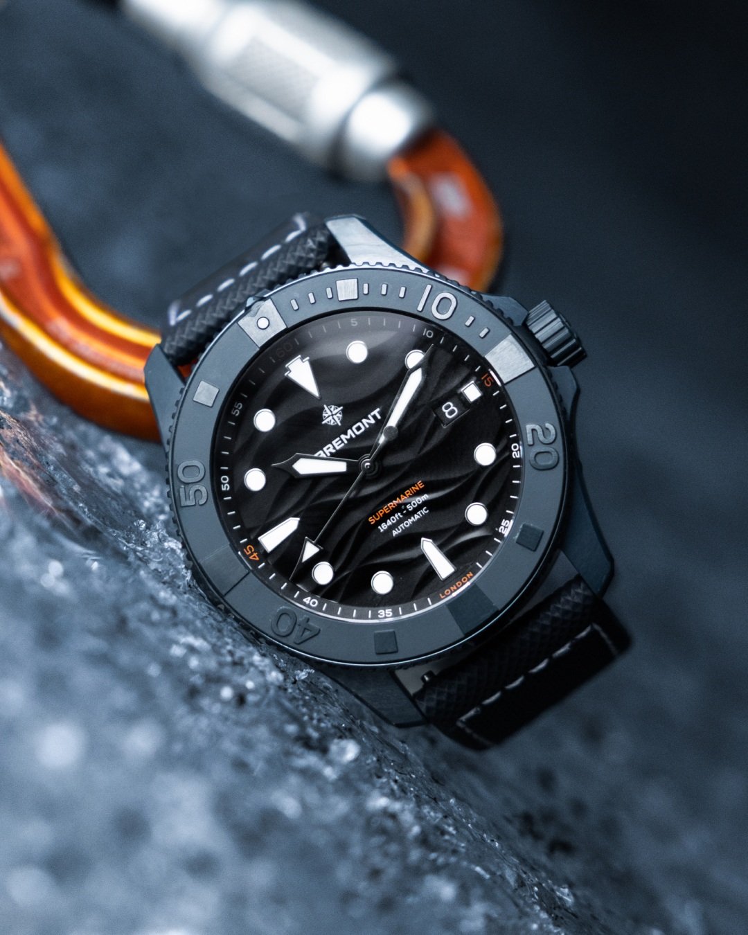 Supermarine Full Ceramic Deep Blue on its side with carabiner