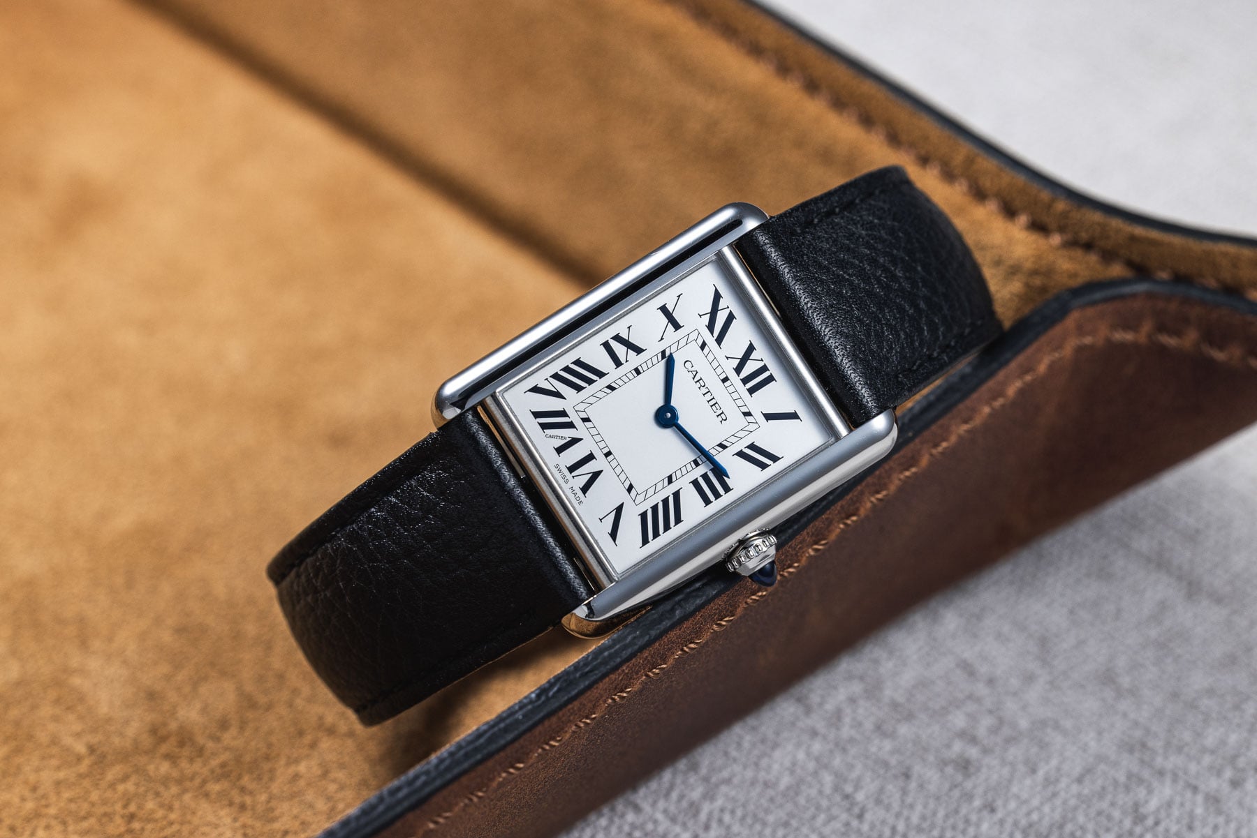 quartz watches — Cartier Tank Must SolarBeat on a black leather strap