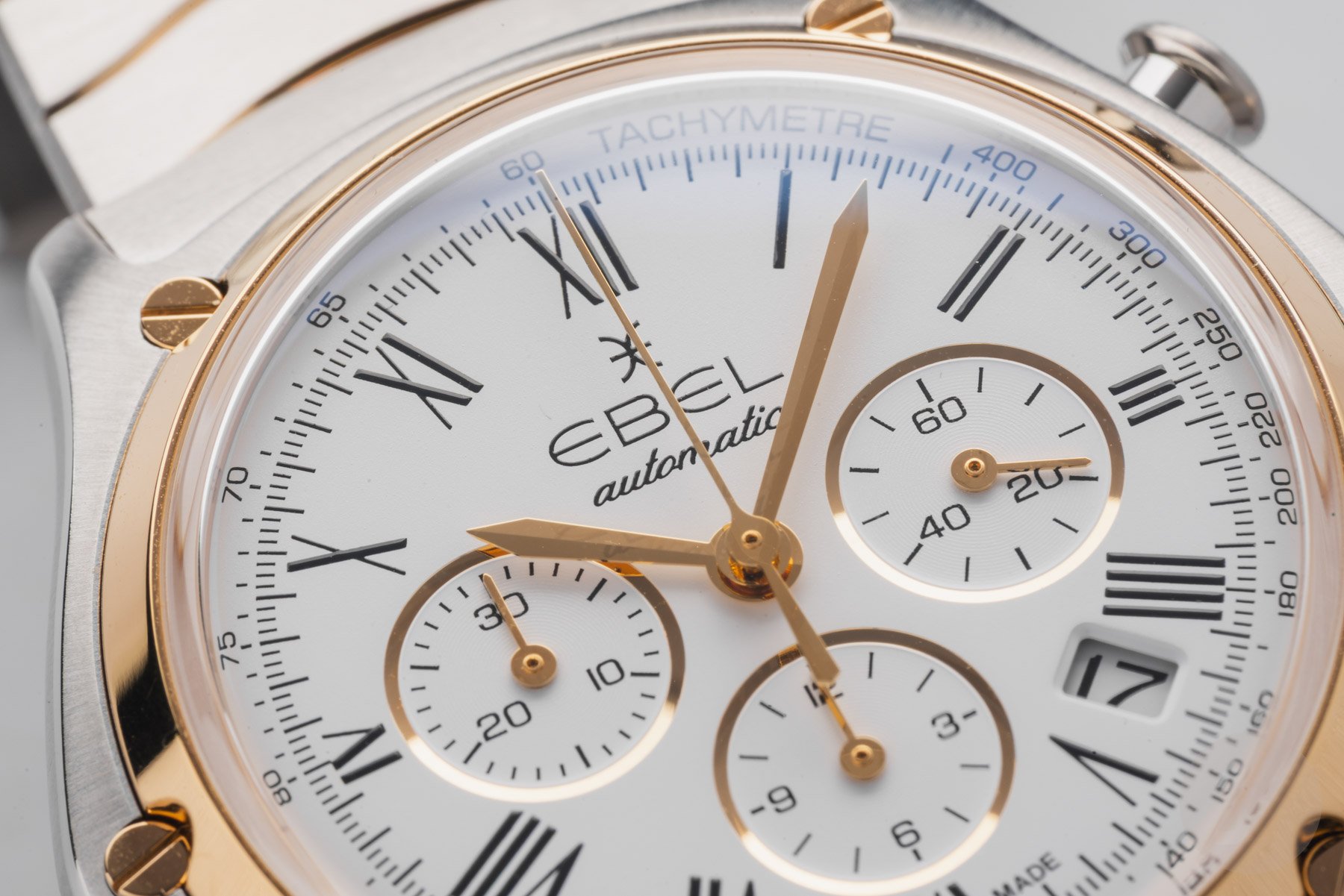 steel-and-gold white-dial Ebel Sport Classic Chronograph LE macro shot