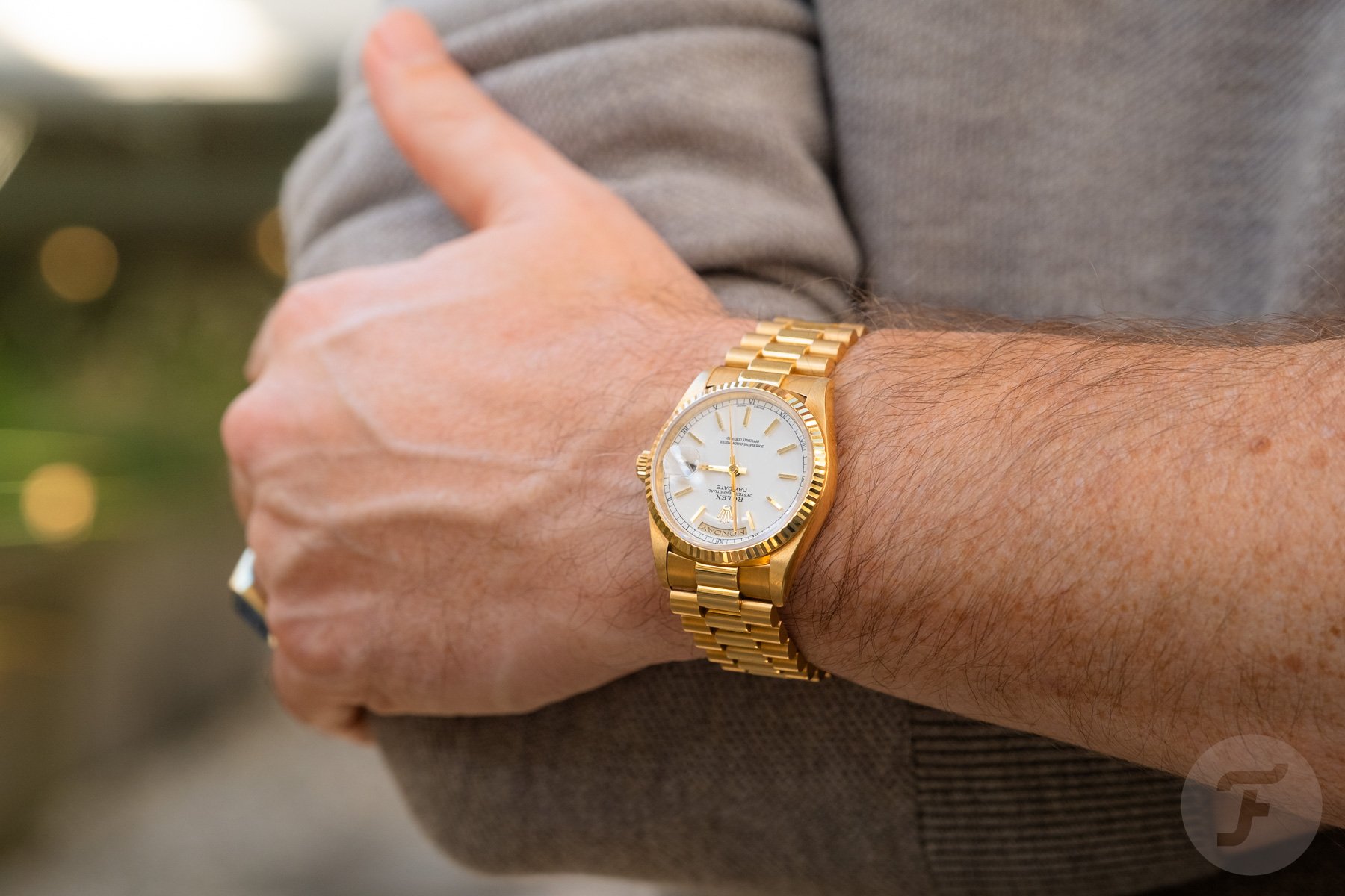 Rolex Day-Date ref. 18238 on wrist, arms crossed
