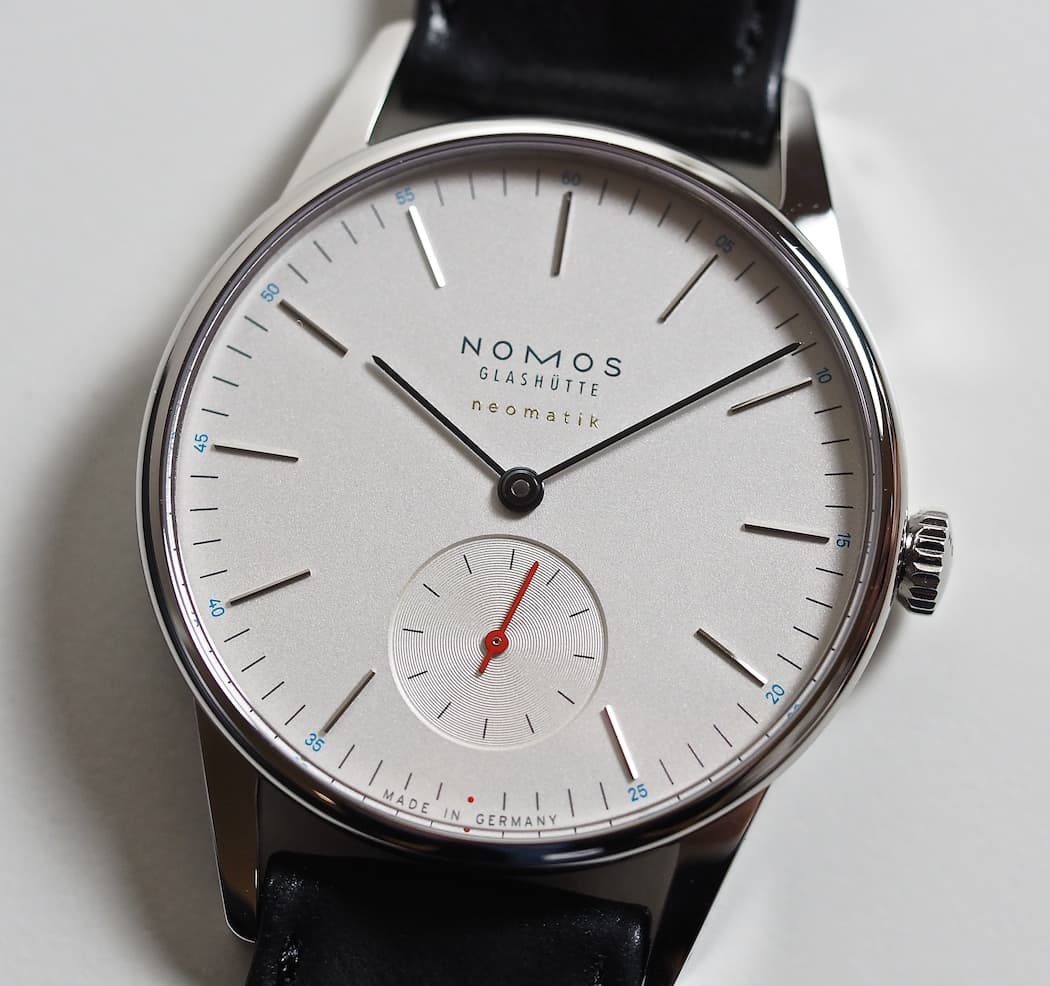 All Nomos Neomatik model with silver dial feature blue numbering and a red seconds hand