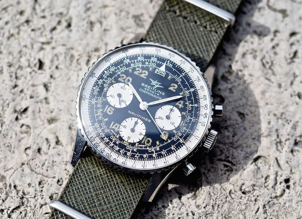 This Breitling 809 Cosmonaute shows a little green slide rule "gunk" around 16:00 - there is no water resistance in this model