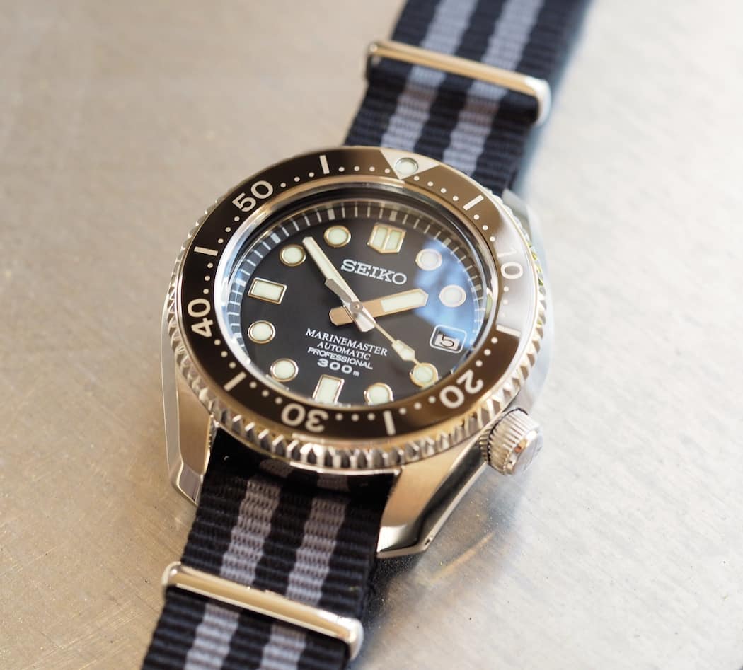 The Seiko MM300 has what I'd call a non-obtrusive date window