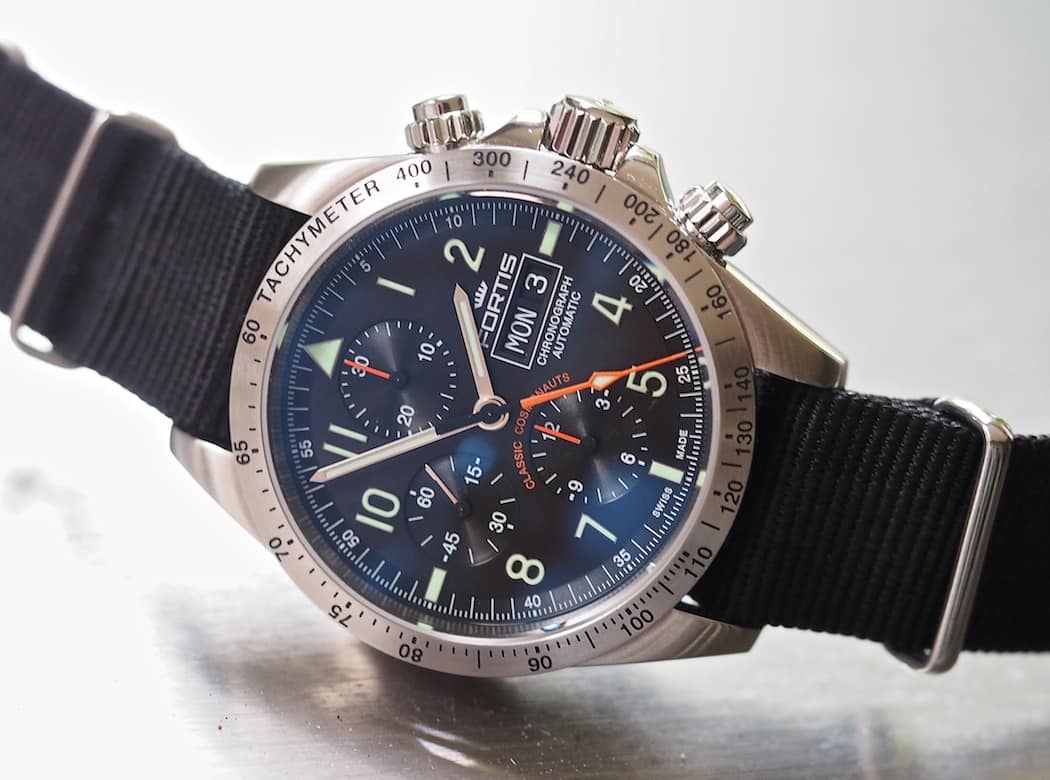 The orange on the dial of the Fortis Classic Cosmonauts adds great contrast as well as the green indices