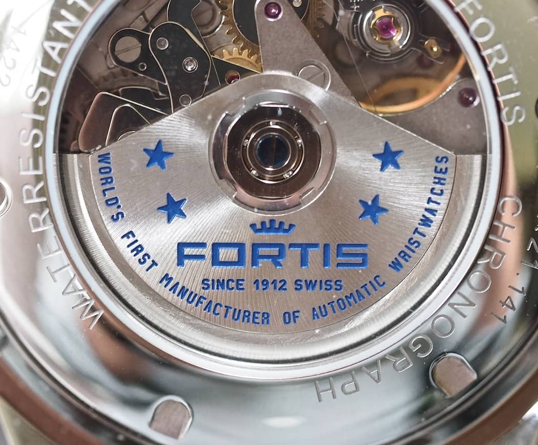 The blue engraved rotor on the Valjoux 7750 found within the Fortis Classic Cosmonauts