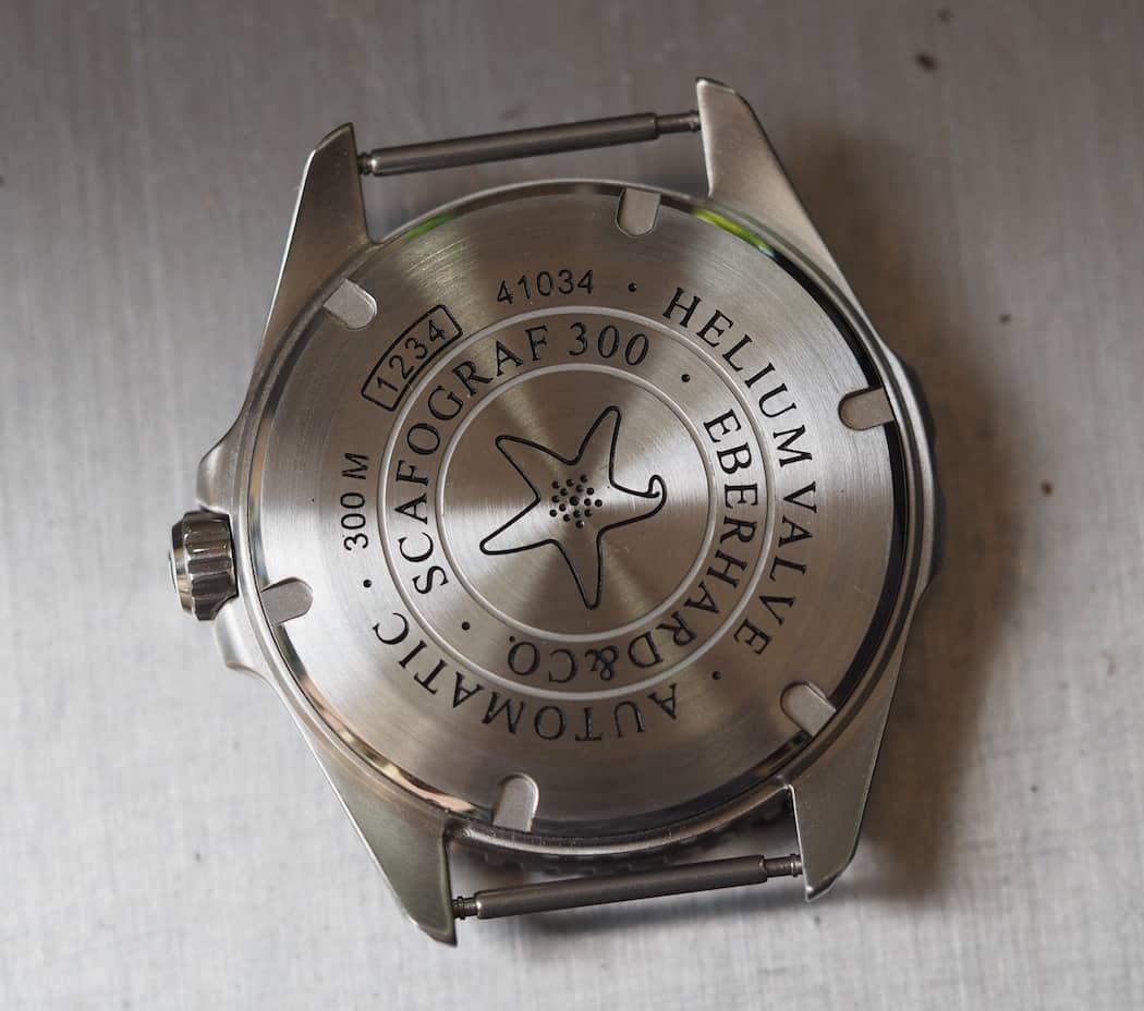 The engraved case back of the Scafograf 300 showing the classic image of the starfish